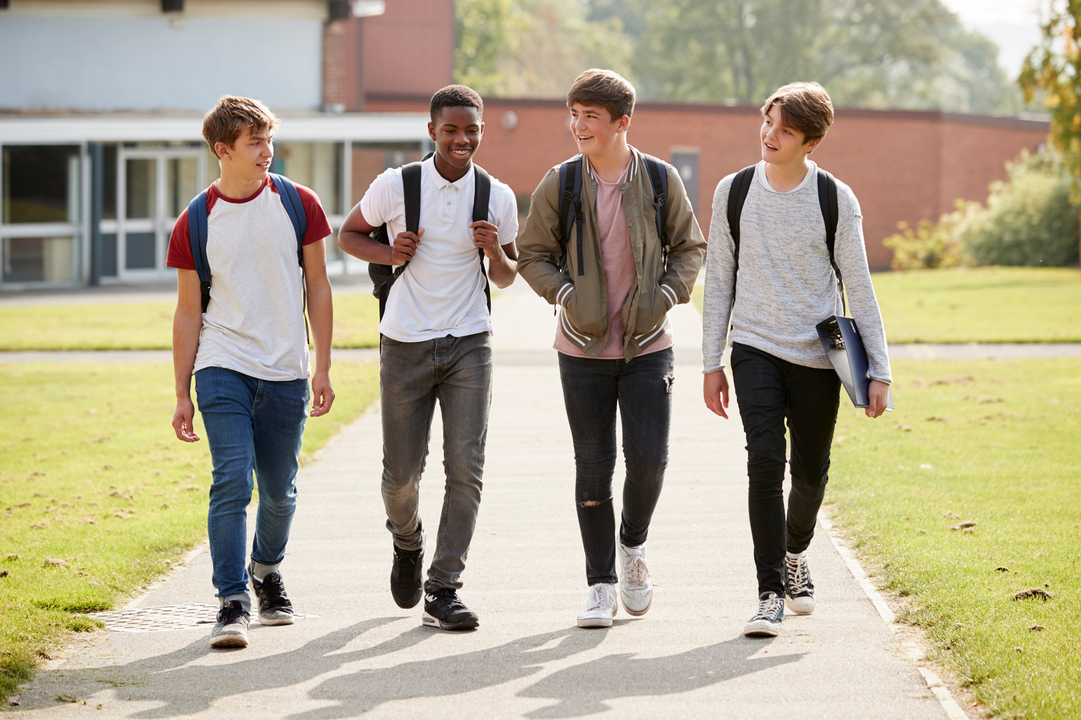 Group of Male Teenage Students Walking 